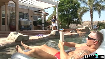 Dirty old dude banging a small titted teens trimmed pussy in the pool